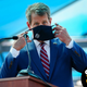 Georgia Governor Brian Kemp getting ready to steal something.